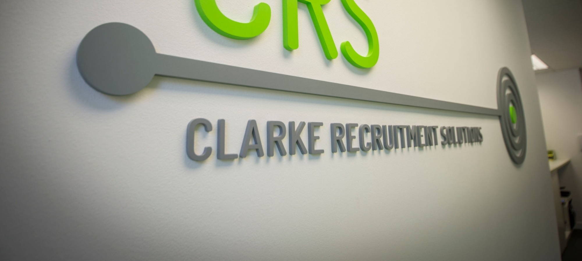 Clarke Recruitment logo placed on our office wall