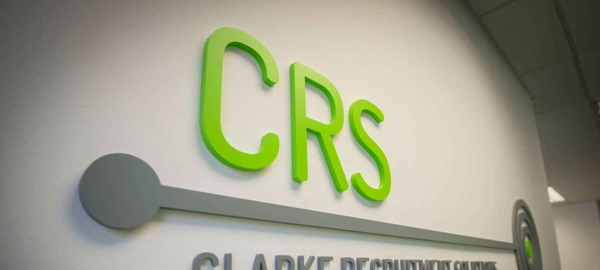 The CRS logo on our office wall.